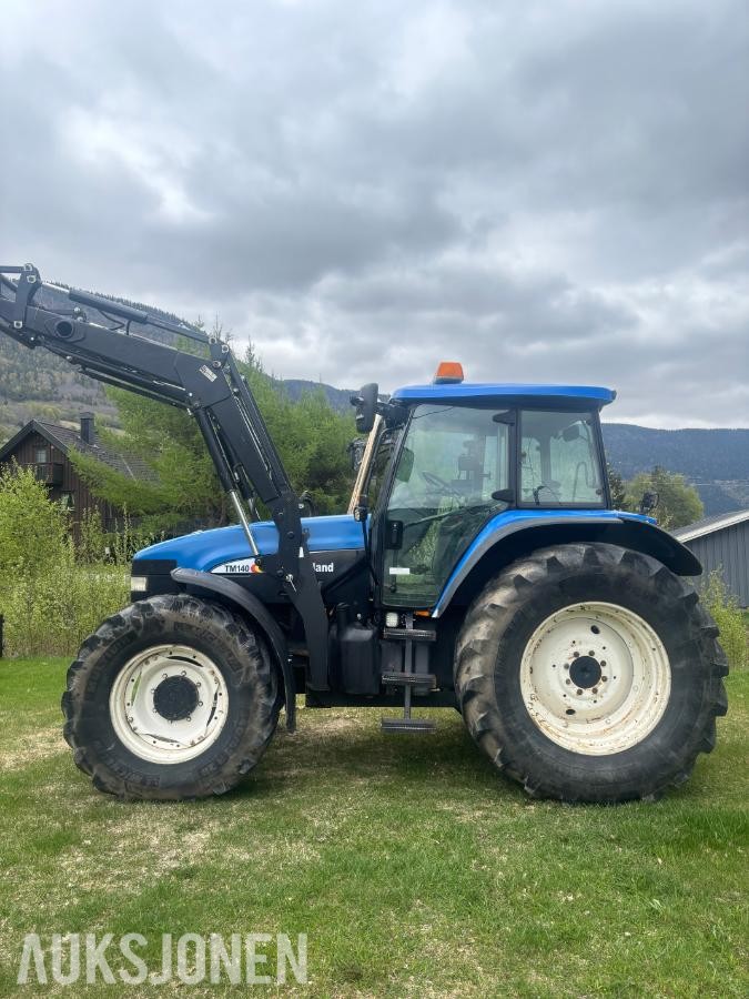 2005 New Holland TD60 traktor med laster
