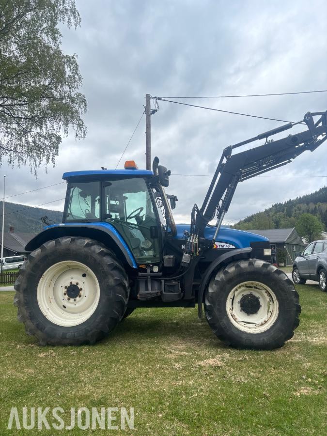 2005 New Holland TD60 traktor med laster