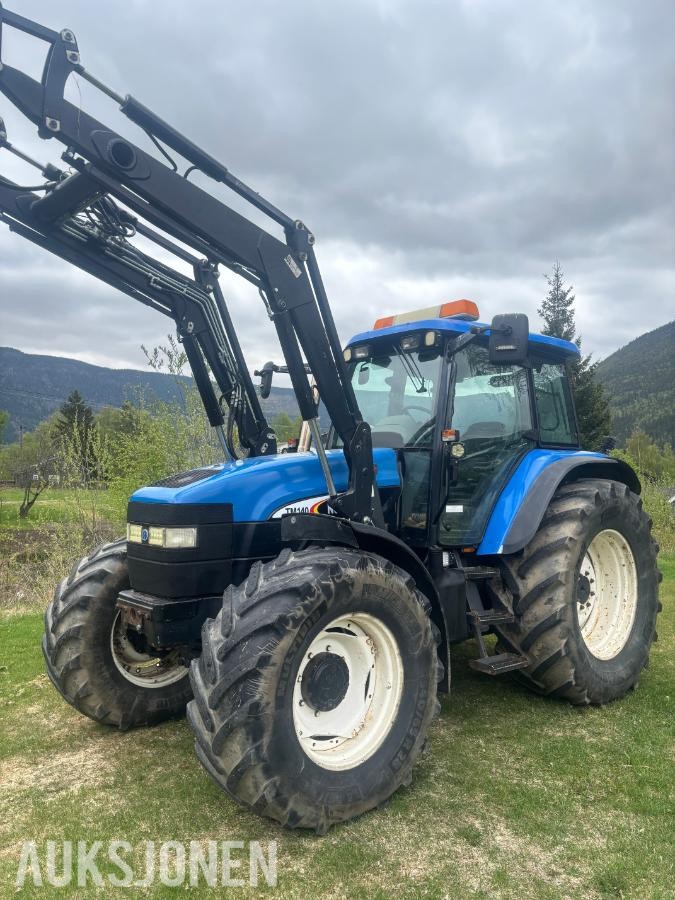 2005 New Holland TD60 traktor med laster