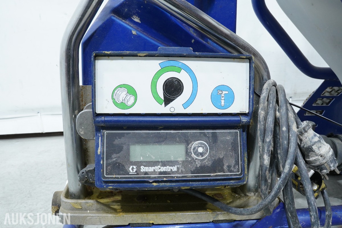 Graco T-MAX 657 sprøyteanlegg med materialbeholder og slanger
