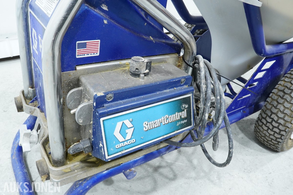 Graco T-MAX 657 sprøyteanlegg med materialbeholder og slanger