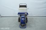 Graco T-MAX 657 sprøyteanlegg med materialbeholder og slanger