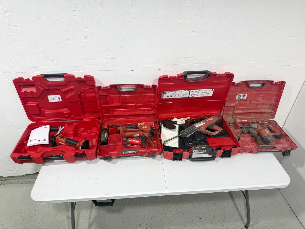 Parti med Hilti vinkelsliper, boltepistol, dispenser og borhammer