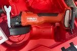 Parti med Hilti vinkelsliper, boltepistol, dispenser og borhammer