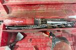 Parti med Hilti vinkelsliper, boltepistol, dispenser og borhammer