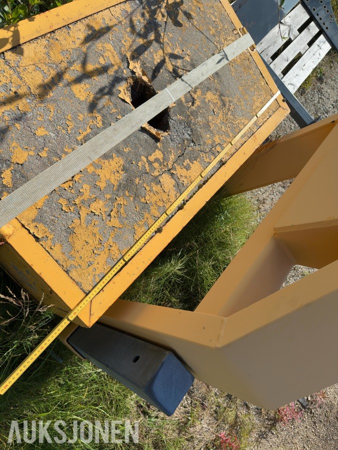 Krokramme med betonglodd