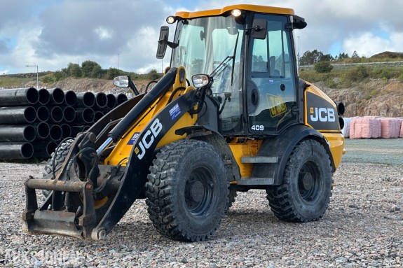 2012 JCB 409B Hjullaster, 5 028 t, skuffe og pallegafler