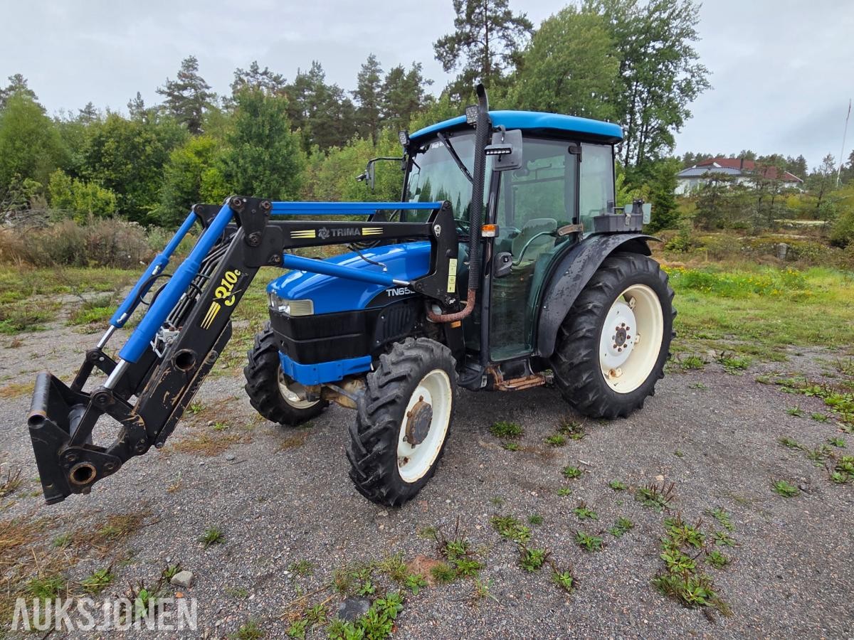 2000 New Holland TN65D med Trima 310C frontlaster