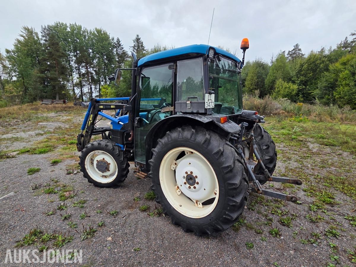 2000 New Holland TN65D med Trima 310C frontlaster