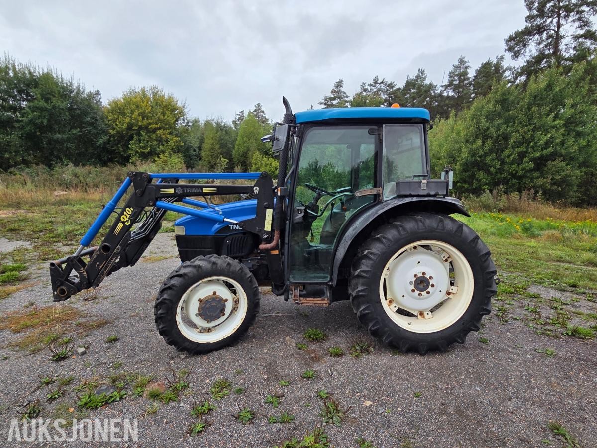 2000 New Holland TN65D med Trima 310C frontlaster