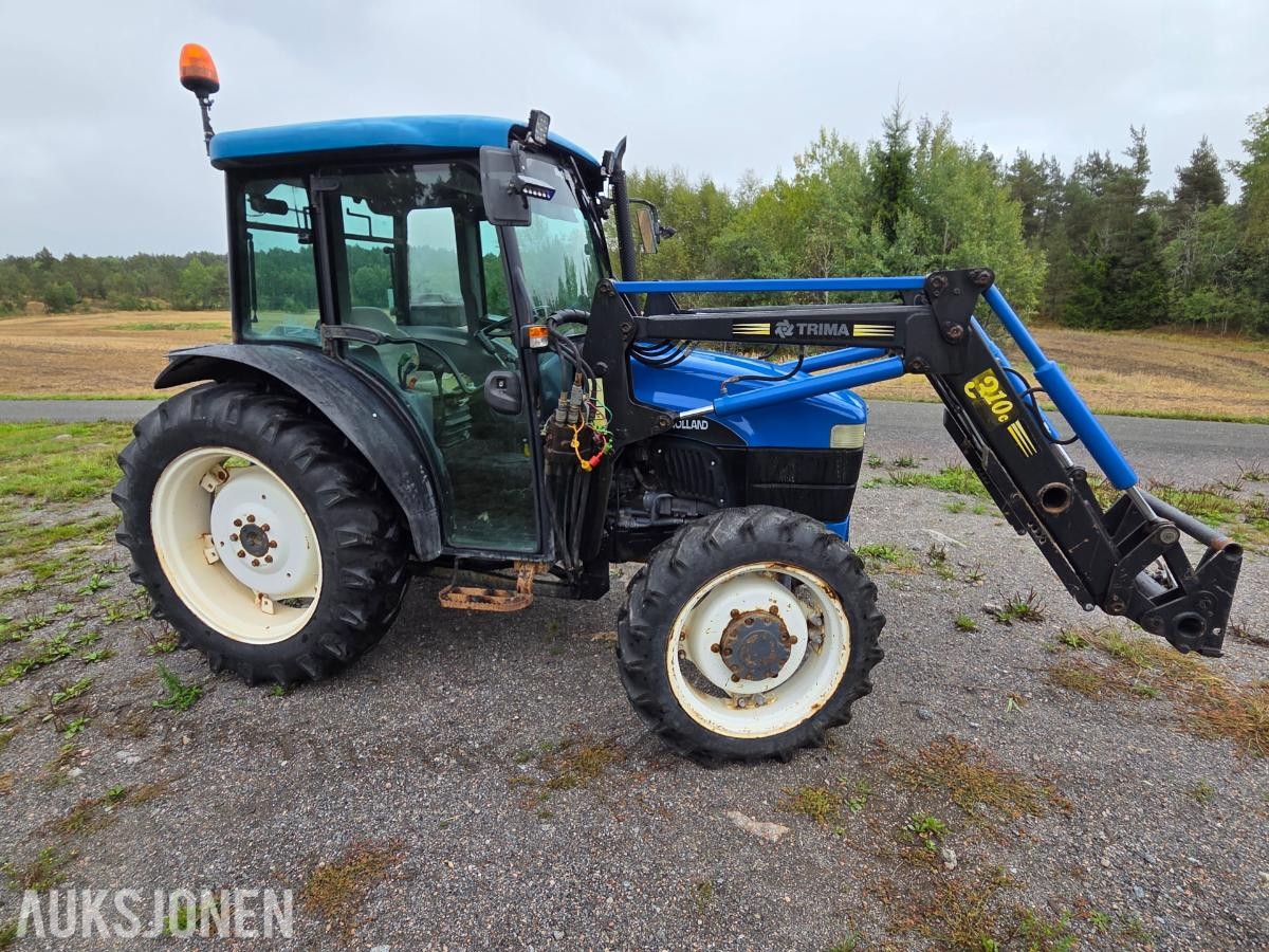 2000 New Holland TN65D med Trima 310C frontlaster