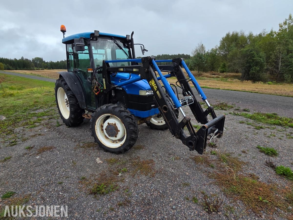 2000 New Holland TN65D med Trima 310C frontlaster