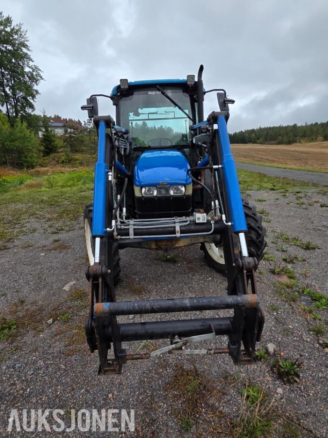 2000 New Holland TN65D med Trima 310C frontlaster