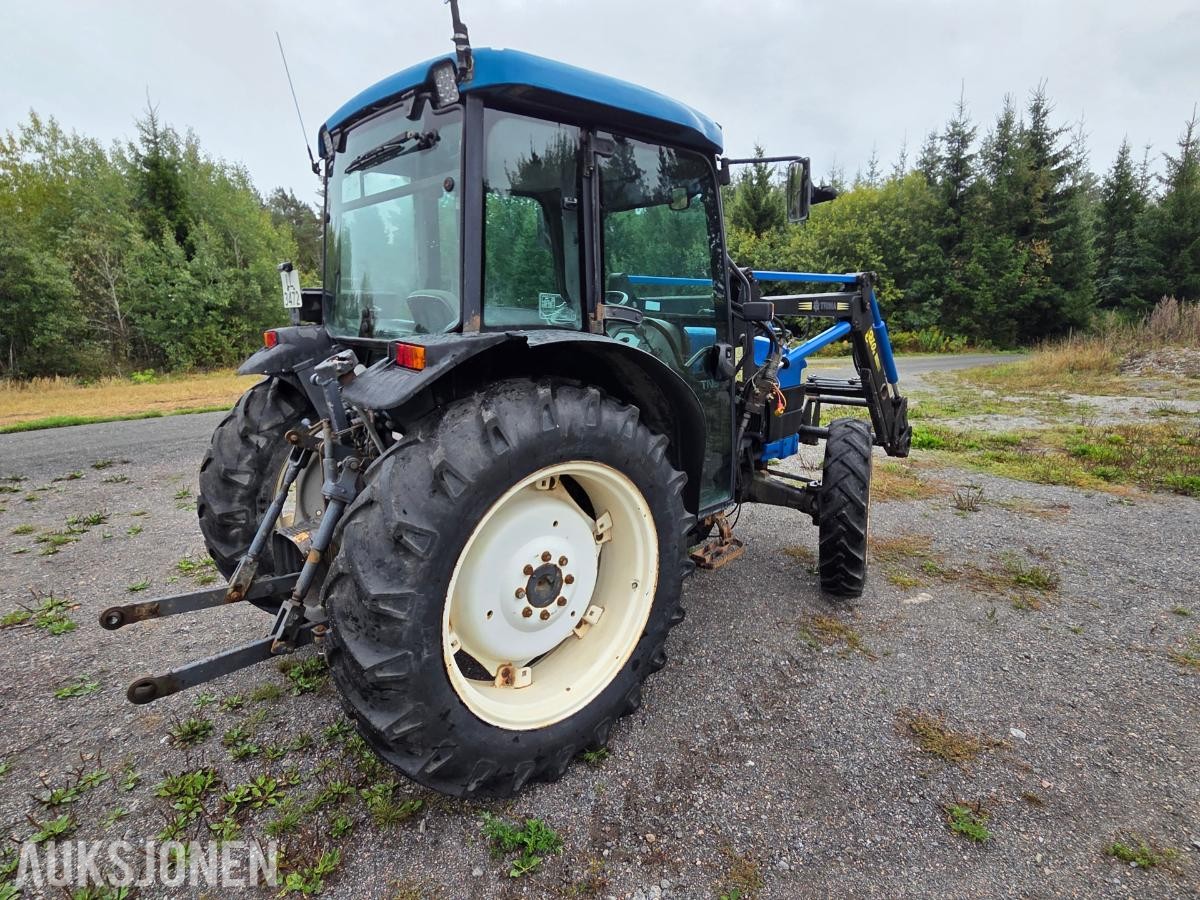 2000 New Holland TN65D med Trima 310C frontlaster