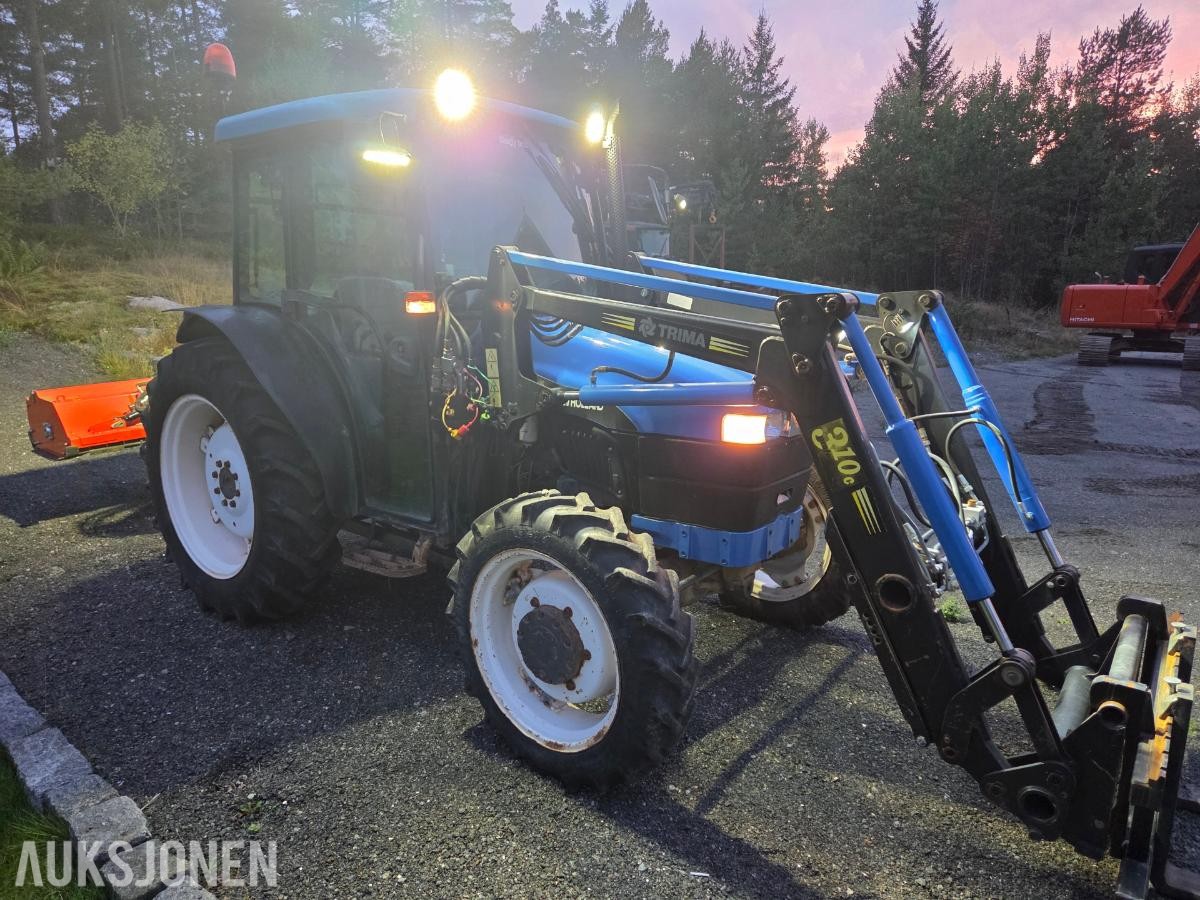 2000 New Holland TN65D med Trima 310C frontlaster