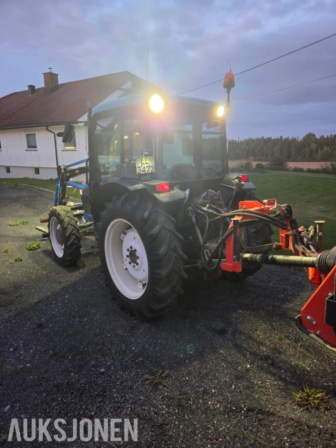 2000 New Holland TN65D med Trima 310C frontlaster