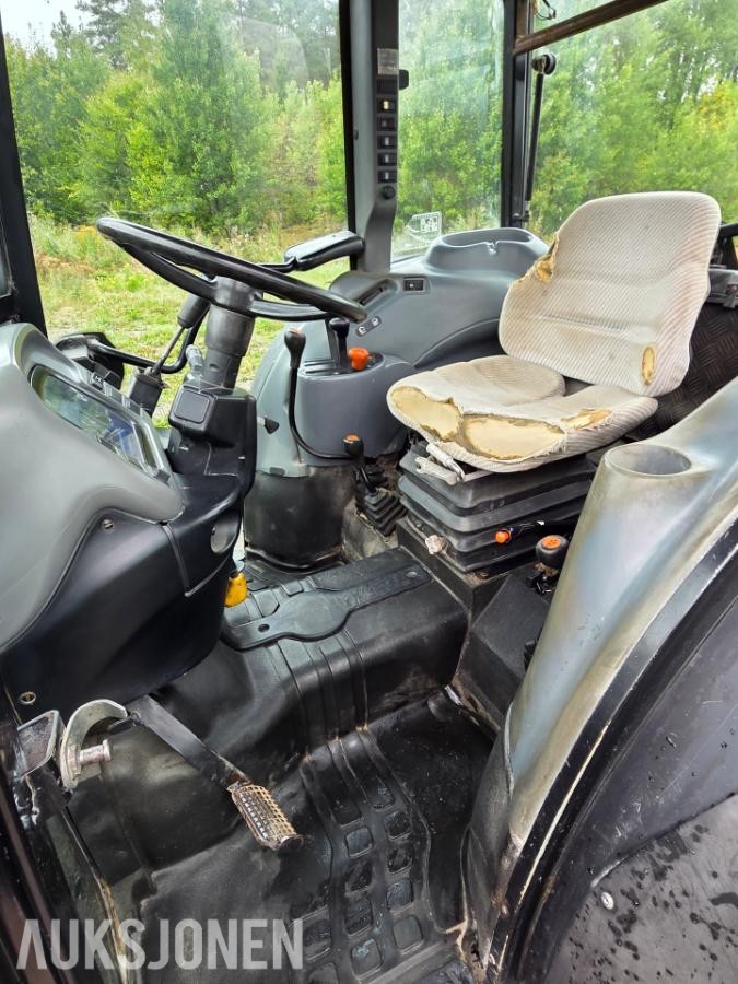 2000 New Holland TN65D med Trima 310C frontlaster