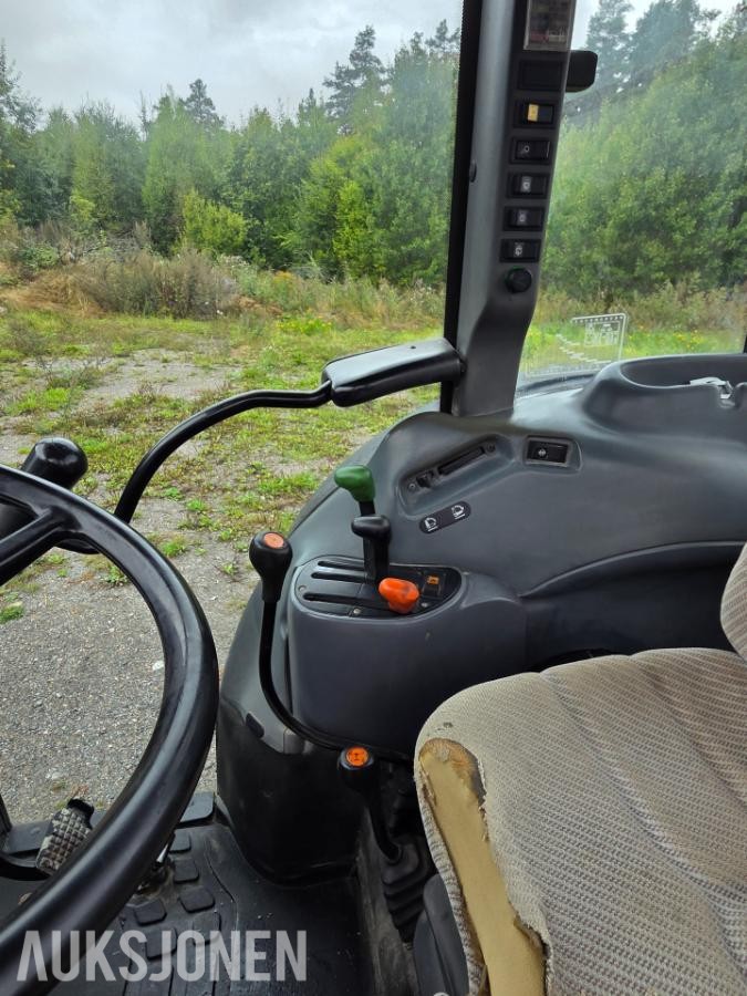 2000 New Holland TN65D med Trima 310C frontlaster