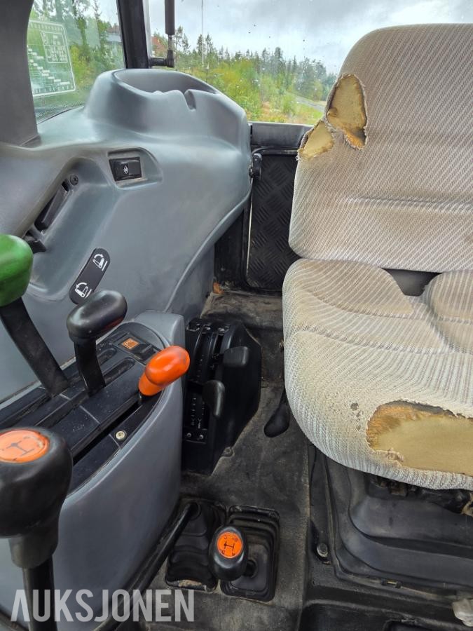 2000 New Holland TN65D med Trima 310C frontlaster