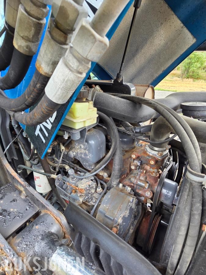 2000 New Holland TN65D med Trima 310C frontlaster