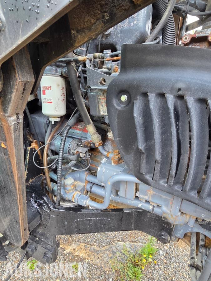 2000 New Holland TN65D med Trima 310C frontlaster