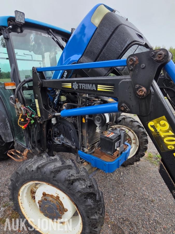 2000 New Holland TN65D med Trima 310C frontlaster