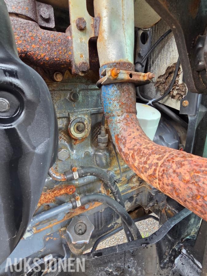 2000 New Holland TN65D med Trima 310C frontlaster