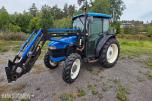 2000 New Holland TN65D med Trima 310C frontlaster
