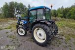 2000 New Holland TN65D med Trima 310C frontlaster
