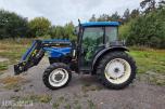 2000 New Holland TN65D med Trima 310C frontlaster