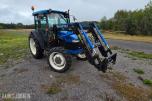 2000 New Holland TN65D med Trima 310C frontlaster