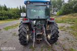 2000 New Holland TN65D med Trima 310C frontlaster