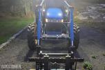 2000 New Holland TN65D med Trima 310C frontlaster
