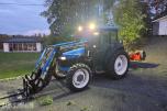 2000 New Holland TN65D med Trima 310C frontlaster