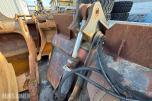 Hjullasterskuffe med hydraulisk klype